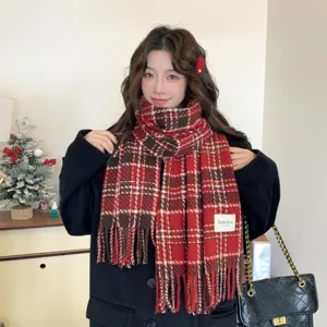 Cozy winter plaid scarf for women, classic red tartan design with stylish fringe details.
