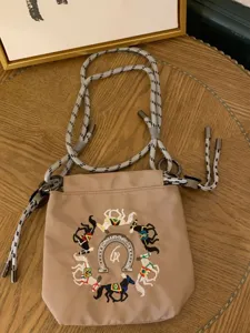Japanese style embroidered drawstring shoulder bag with chic horse pattern and durable rope straps.