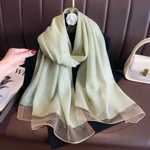 Lightweight sheer green scarf with elegant brown gradient hem for women sun protection chic.