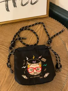 Chic black embroidered drawstring shoulder bag with cat design and casual style for women.