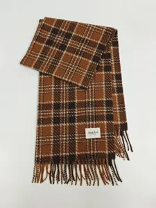 Cozy brown plaid winter scarf with chic tassels, soft warm neckerchief detail view.