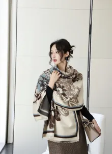 Detailed view of a stylish women winter jacquard patterned shawl scarf with fringe.