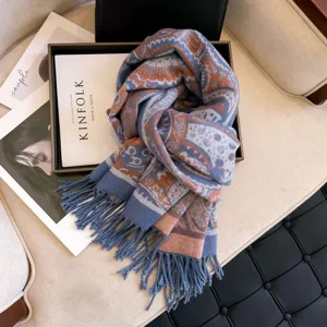 Detailed view of the winter warm jacquard scarf with classic paisley pattern and fringe hem.
