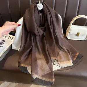 Elegant brown shimmering long silk scarf for women, lightweight fashion shawl wrap.