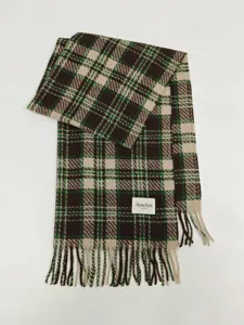 Classic green and brown plaid winter scarf detail, cozy tassel fringe design for daily wear.