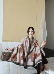Close-up view of the elegant floral jacquard winter shawl worn by the model indoors.