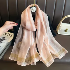 Pink striped silk feel long scarf for women elegant fashion accessory detail view.