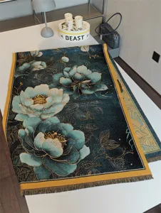 Detailed view of the luxury jacquard winter scarf with elegant floral pattern and fringe trim.