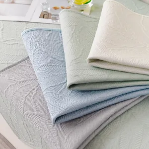 Funda de sofá de jacquard de punto refrescante de verano con elegante diseño de hojas.