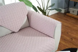Quilted pink sofa cover detail, modern minimalist soft fabric daily protective slipcover.