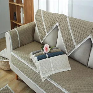 Quilted solid fabric sofa cushion detail view with elegant lace trim and non-slip backing.