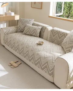 Detailed view of modern minimalist cotton linen sofa cushion with cozy zigzag chevron pattern.