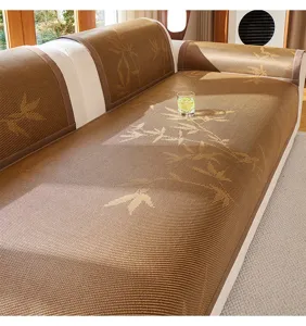 Close-up of Chinese style cooling bamboo rattan sofa mat with elegant leaf pattern texture.