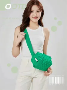 Green knit crossbody bag detail, textured bubble design shoulder bag for women daily commute.