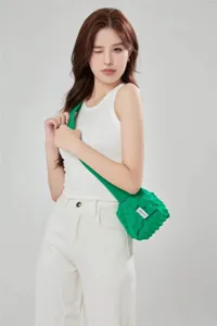 Green knitted bubble shoulder bag for women, trendy chic casual crossbody bag style.