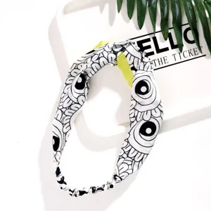 Black and white abstract printed knotted hair hoop with yellow lining for women daily wear.