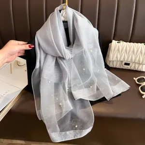 Elegant grey chiffon silk scarf featuring sparkling rhinestone and pearl floral details.