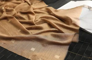 Elegant silk wool blend scarf with gold grid details, perfect for spring and autumn.