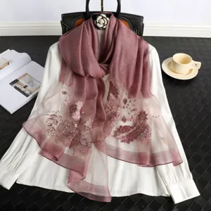 Elegant mulberry silk embroidered long scarf for women, featuring delicate floral patterns.
