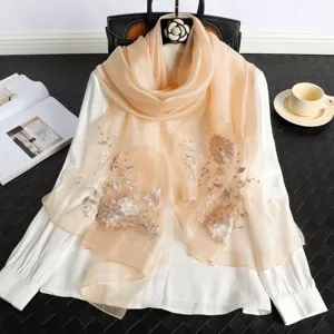 Elegant champagne silk scarf with exquisite floral embroidery for women's spring and autumn wear.