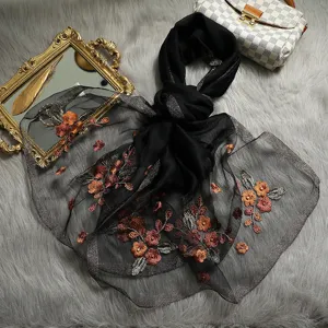 Elegant black sheer embroidered silk scarf with vintage floral design, luxurious fashion shawl for women.