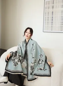 Detailed view of winter warm jacquard reversible shawl, elegant floral pattern design.