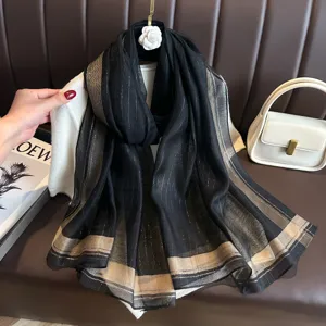 Black and gold striped faux silk scarf, elegant long shawl for women, chic fashion accessory.