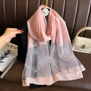 Pink organza pearl embellished sheer scarf detail shot, elegant women summer sun protection shawl.