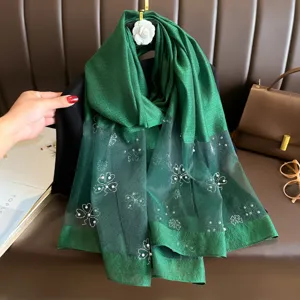 Green polyester long scarf featuring elegant rhinestone clover and pearl details for women.