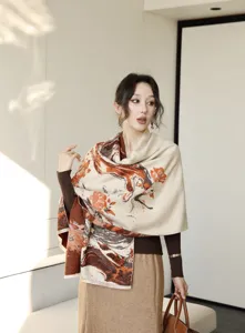 Detail shot of womens winter warm jacquard printed scarf worn by model indoors.