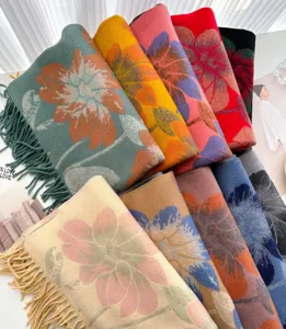 Detailed view of colorful floral pattern core-spun yarn tassel scarves for winter styling.