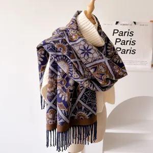 Detailed view of a thick retro patterned winter scarf with tassels, draped on a mannequin.