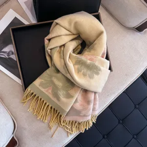 Close-up of cozy floral jacquard winter women scarf featuring elegant long fringe and warm texture.