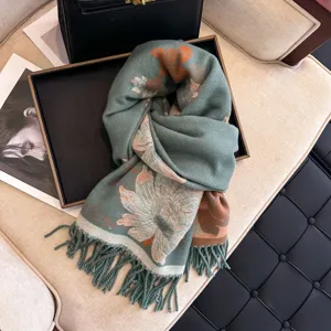 Detailed view of the elegant floral jacquard winter scarf with long tassels and soft fabric.