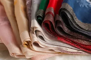 Luxury silk wool embroidered scarf shawl with shimmering metallic border and elegant design.