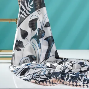 Lightweight printed silk scarf for women, featuring elegant botanical pattern and versatile style.