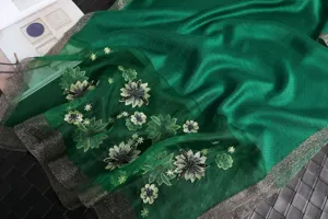 Detailed view of luxury green silk wool embroidered scarf showcasing exquisite floral craftsmanship.