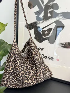 Leopard print canvas shoulder bag detail, casual soft cotton tote bag for women daily use.