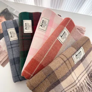 Detailed view of cozy winter plaid tassel scarves in multiple colors, soft wool blend, stylish.