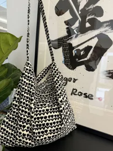 Black and white knit shoulder bag featuring floral pattern stylish casual tote bag