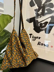 Vintage floral cotton canvas shoulder bag for women, casual retro crossbody bag detail.