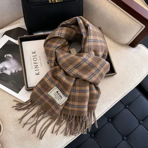 Cozy brown plaid winter scarf with classic fringe design, warm women neck wrap accessory.