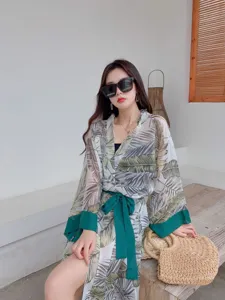 Summer tropical leaf print kimono beach cover-up with green sash and cuffs for women.