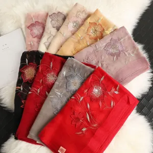 Women's silk wool blend scarf featuring elegant sequin floral embroidery and shawl.