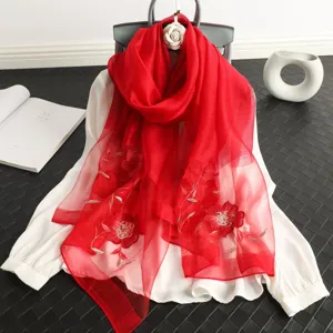 Red silk wool scarf with sequin embroidery, elegant floral design, perfect women shawl accessory.