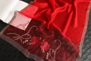 Red silk wool blend scarf detail with exquisite peony embroidery and metallic trim edge.