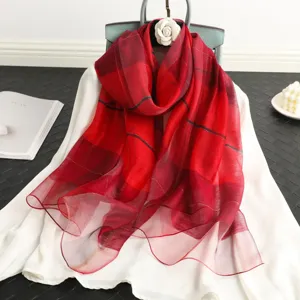 Red plaid silk wool scarf for women, elegant lightweight shawl and sun protection accessory.