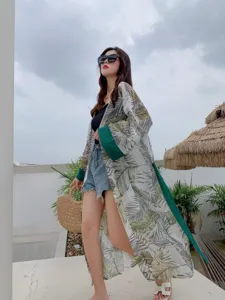 Women long summer sun protection cardigan with green leaf print for beach outdoor wear detail