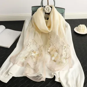 Exquisite embroidered silk wool blend scarf featuring delicate floral embroidery details.