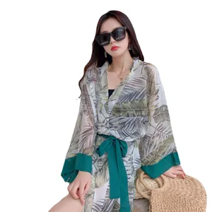 Summer beach sun protection kimono cardigan with elegant green leaf print and stylish belt.